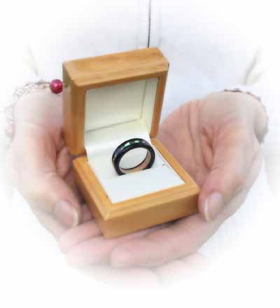 presenting an wooden engagment ring